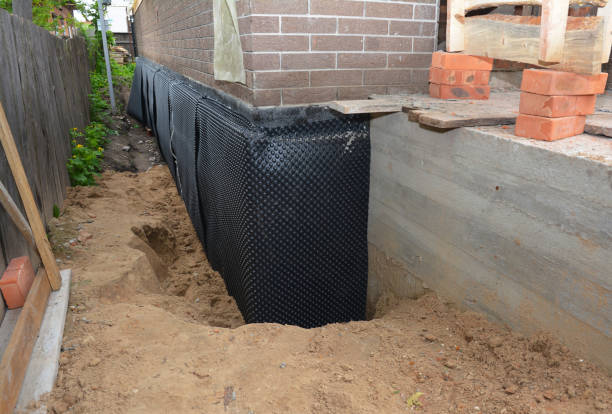 Happy homeowners after waterproofing job in McEwen